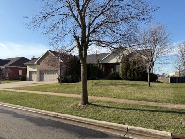 2026 Stonehaven Dr, Sun Prairie, WI 53590 - ranch-style house featuring a front lawn, a garage, and concrete driveway