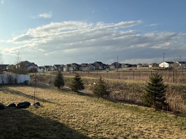 2026 Stonehaven Dr, Sun Prairie, WI 53590 - view of yard with fence and a residential view