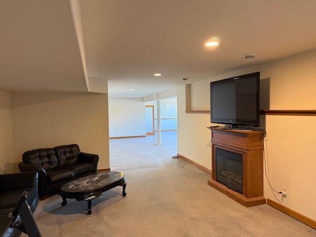 2026 Stonehaven Dr, Sun Prairie, WI 53590 - living area with light colored carpet, a glass covered fireplace, recessed lighting, and baseboards