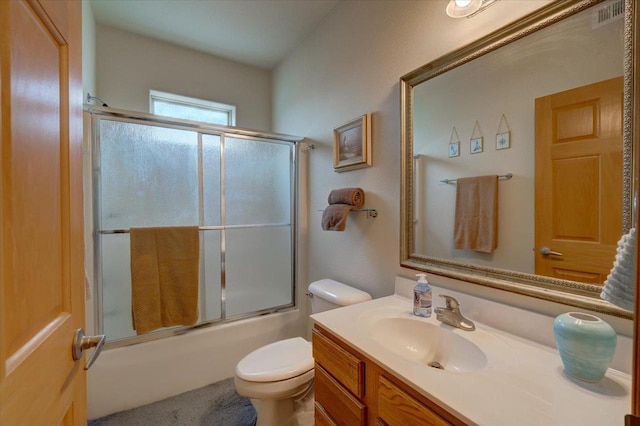 2026 Stonehaven Dr, Sun Prairie, WI 53590 - bathroom featuring toilet, visible vents, enclosed tub / shower combo, and vanity