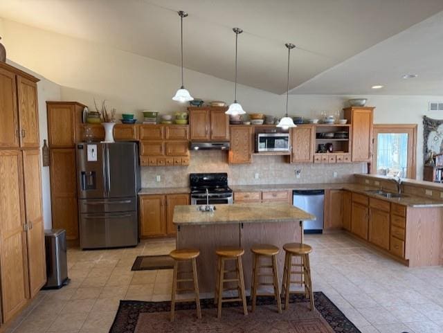 2026 Stonehaven Dr, Sun Prairie, WI 53590 - kitchen featuring appliances with stainless steel finishes, decorative backsplash, open shelves, and a sink