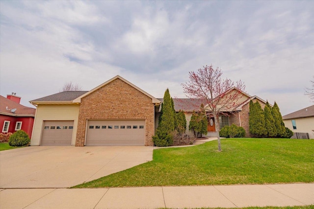 2026 Stonehaven Dr, Sun Prairie, WI 53590 - ranch-style home featuring driveway, a front yard, brick siding, and a garage
