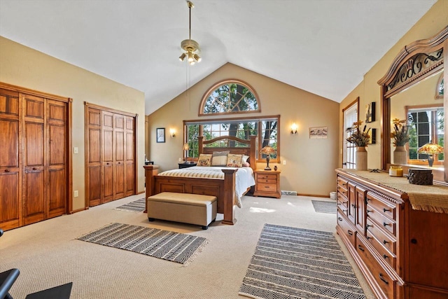 W1335 N Blue Spring Lake Dr, Palmyra, WI 53156 - bedroom featuring light colored carpet, high vaulted ceiling, baseboards, multiple closets, and visible vents