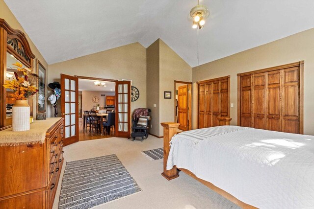 W1335 N Blue Spring Lake Dr, Palmyra, WI 53156 - bedroom with high vaulted ceiling, french doors, two closets, and light colored carpet