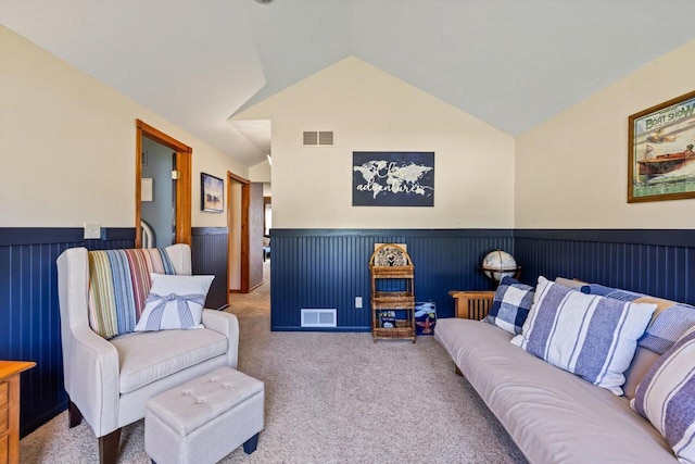 W1335 N Blue Spring Lake Dr, Palmyra, WI 53156 - living area featuring vaulted ceiling, visible vents, carpet flooring, and wainscoting