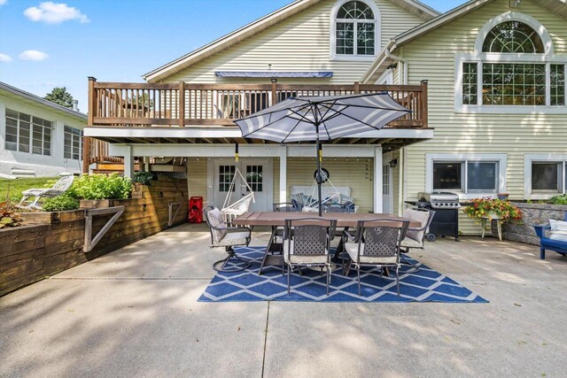 W1335 N Blue Spring Lake Dr, Palmyra, WI 53156 - rear view of property featuring outdoor dining space, a deck, and a patio area