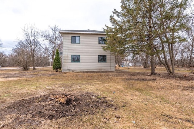 view of home's exterior featuring a yard