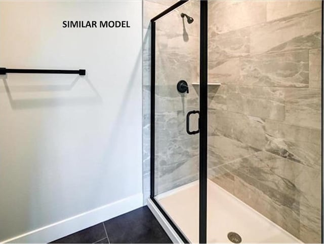 6643 Royal View Dr, Deforest, WI 53532 - bathroom featuring baseboards and a shower stall