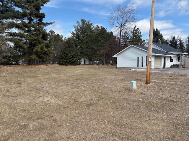1006 Lulu Ave, Crivitz, WI 54114 - view of yard featuring a garage