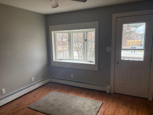 1006 Lulu Ave, Crivitz, WI 54114 - entryway with wood finished floors and a baseboard radiator