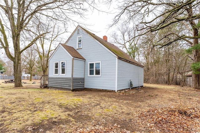 3202 120th St, Chippewa Falls, WI 54729 - rear view of house featuring a chimney and roof with shingles