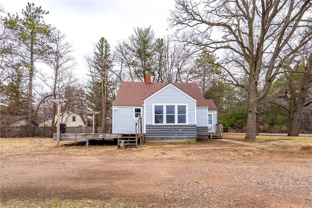 3202 120th St, Chippewa Falls, WI 54729 - view of front of property featuring entry steps, roof with shingles, and a chimney