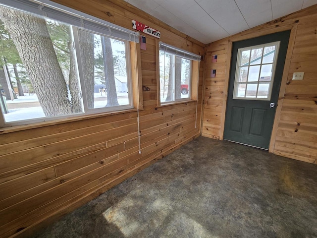 N10444 N Horseshoe Rd, Tomahawk, WI 54487 - interior space with vaulted ceiling, wood walls, and concrete flooring