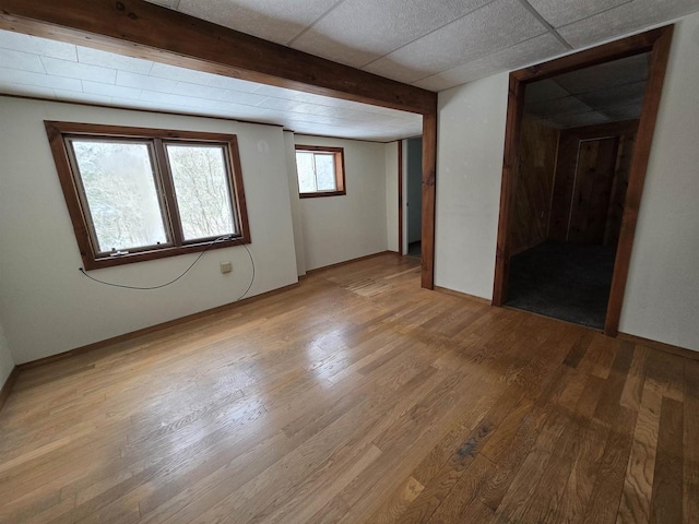 N10444 N Horseshoe Rd, Tomahawk, WI 54487 - spare room with baseboards, a drop ceiling, and light wood finished floors