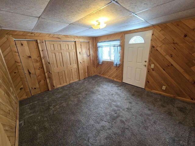 N10444 N Horseshoe Rd, Tomahawk, WI 54487 - carpeted foyer entrance featuring wood walls and a paneled ceiling