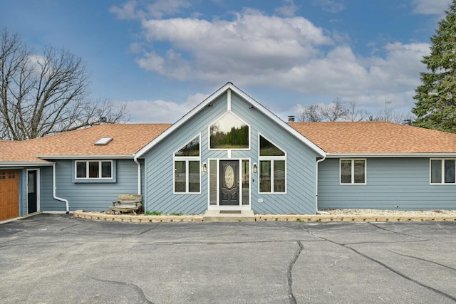 W590 Kearney Rd, Burlington, WI 53105 - view of front of property with a chimney, a shingled roof, and driveway