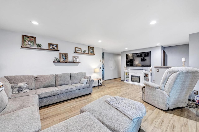 3237 Mill Rd, Greenleaf, WI 54126 - living room featuring a fireplace, wood finished floors, and recessed lighting