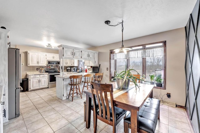 3237 Mill Rd, Greenleaf, WI 54126 - dining area with light tile patterned floors and baseboards
