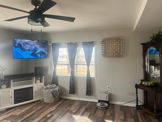 25290 Foothill Ave, Tomah, WI 54660 - living room featuring baseboards, dark wood-style flooring, and a ceiling fan