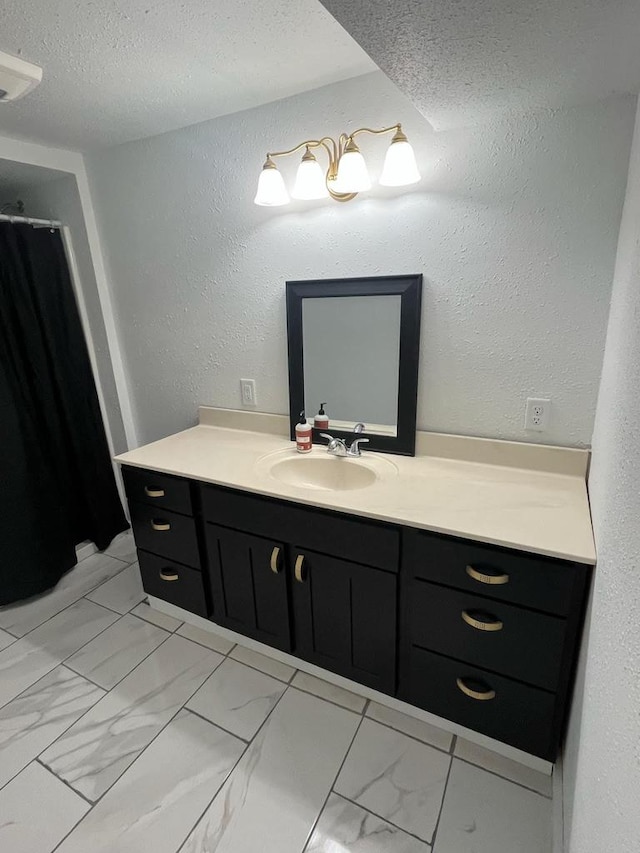 25290 Foothill Ave, Tomah, WI 54660 - full bath with marble finish floor, a textured ceiling, a textured wall, and vanity