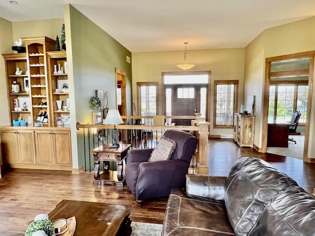 living area featuring wood finished floors and baseboards