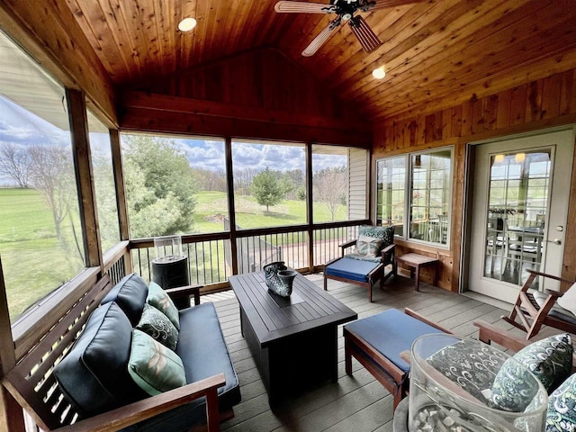 sunroom / solarium featuring outdoor lounge area, a ceiling fan, and a wealth of natural light
