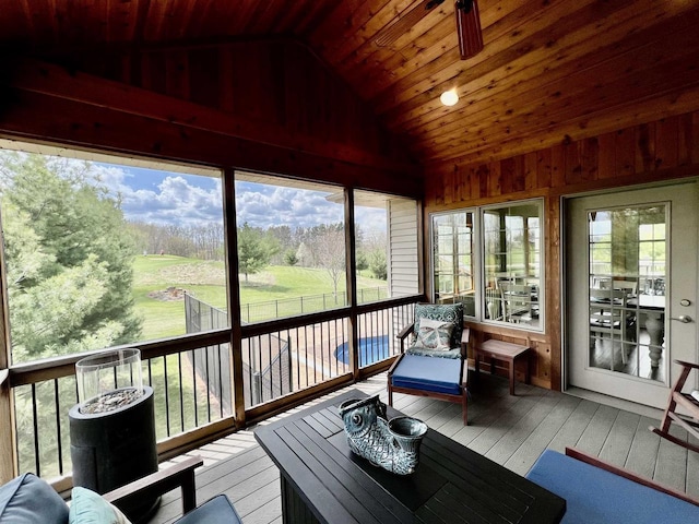 sunroom / solarium featuring ceiling fan