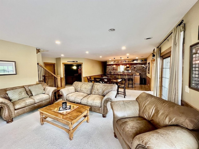 living area with stairs, carpet floors, and recessed lighting