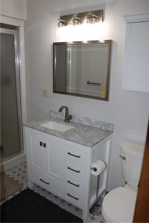 28942 Spring Green Way, Danbury, WI 54830 - bathroom with toilet, vanity, and a shower stall