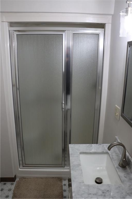 28942 Spring Green Way, Danbury, WI 54830 - bathroom featuring a shower stall and a sink