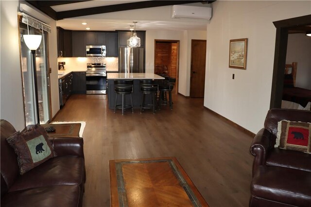 28942 Spring Green Way, Danbury, WI 54830 - living room featuring a wall mounted air conditioner, dark wood-style floors, baseboards, and beam ceiling