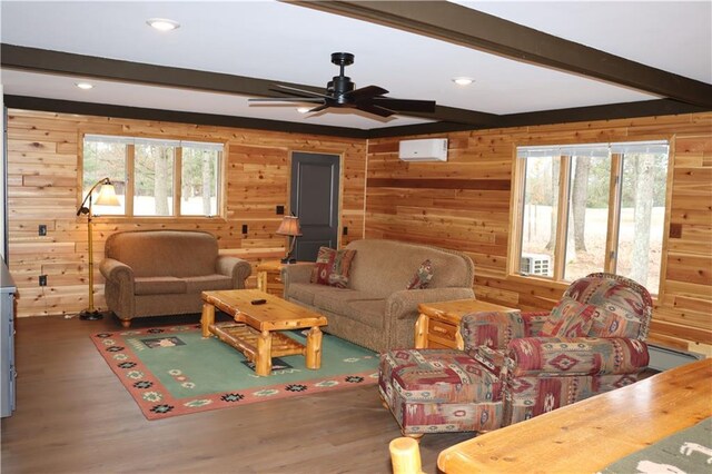 28942 Spring Green Way, Danbury, WI 54830 - living area with wood walls, beam ceiling, and a healthy amount of sunlight