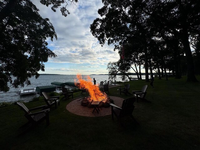 549 Illinois Ave, Green Lake, WI 54941 - exterior space with a yard, a dock, and a water view
