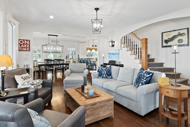549 Illinois Ave, Green Lake, WI 54941 - living area featuring ornamental molding, stairway, and dark wood finished floors