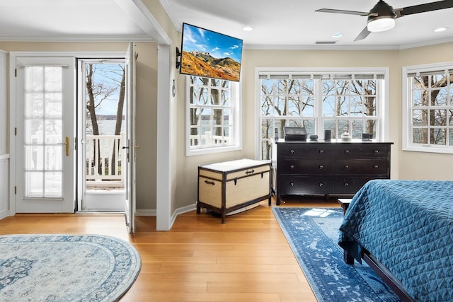549 Illinois Ave, Green Lake, WI 54941 - bedroom featuring access to outside, multiple windows, and crown molding