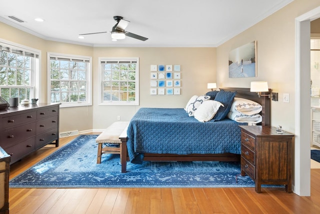 549 Illinois Ave, Green Lake, WI 54941 - bedroom featuring hardwood / wood-style floors, visible vents, and crown molding