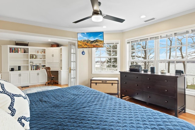 549 Illinois Ave, Green Lake, WI 54941 - bedroom with visible vents, ornamental molding, recessed lighting, and wood finished floors