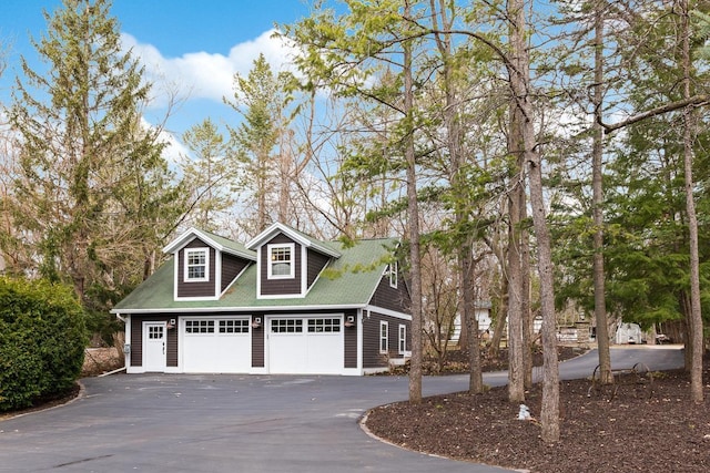 549 Illinois Ave, Green Lake, WI 54941 - cape cod house with a detached garage