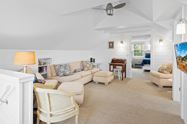549 Illinois Ave, Green Lake, WI 54941 - carpeted living area with wood walls, a ceiling fan, and lofted ceiling