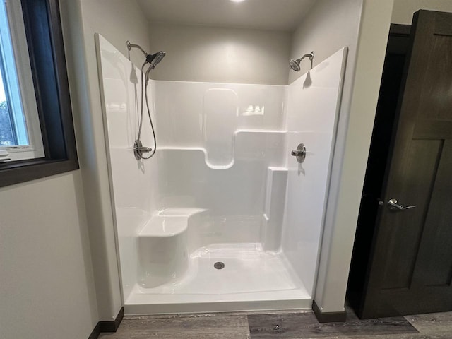 N1647 21st Ave, Wautoma, WI 54982 - full bathroom with walk in shower, baseboards, and wood finished floors