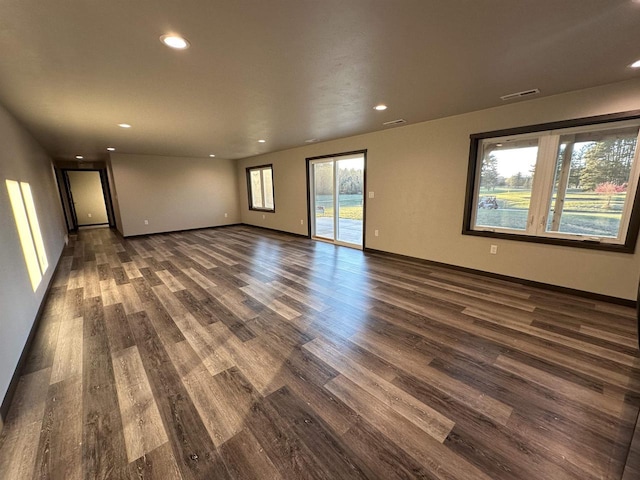 N1647 21st Ave, Wautoma, WI 54982 - empty room with dark wood finished floors, baseboards, visible vents, and recessed lighting
