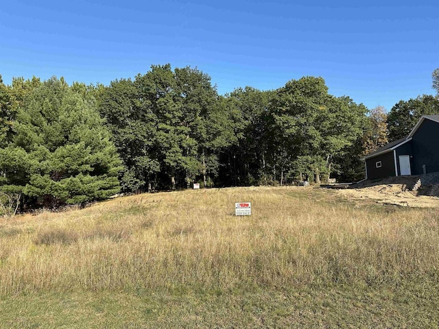 N1647 21st Ave, Wautoma, WI 54982 - view of yard with a forest view