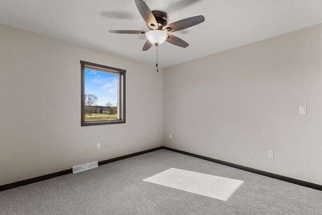N1647 21st Ave, Wautoma, WI 54982 - spare room with light carpet, a ceiling fan, visible vents, and baseboards