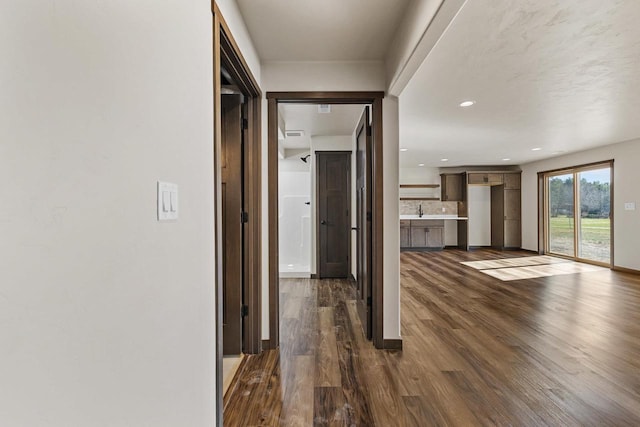 N1647 21st Ave, Wautoma, WI 54982 - hall featuring baseboards, recessed lighting, and dark wood-type flooring