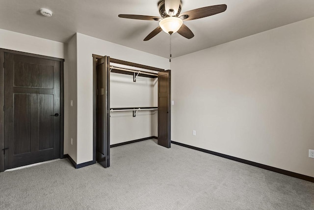 N1647 21st Ave, Wautoma, WI 54982 - unfurnished bedroom with a closet, light carpet, a ceiling fan, and baseboards