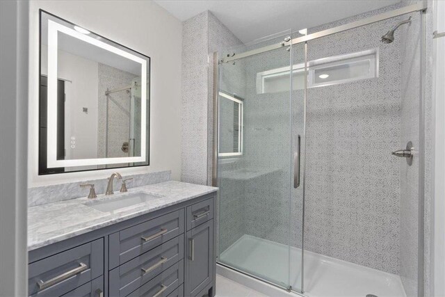 425 W 8th St Unit 20, New Richmond, WI 54017 - bathroom with vanity and a shower stall