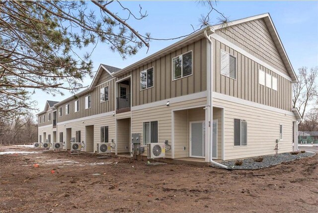 425 W 8th St Unit 20, New Richmond, WI 54017 - multi unit property featuring ac unit and board and batten siding