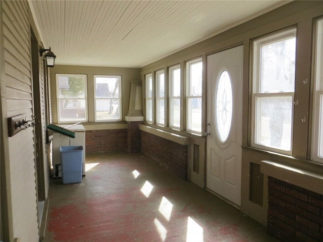 204 W Main St, Thorp, WI 54771 - unfurnished sunroom featuring brick floor, wooden ceiling, and brick wall