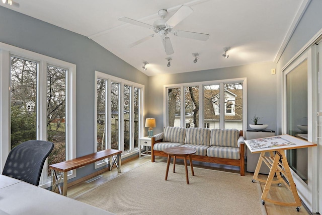 831 Sauganash Dr, Fontana, WI 53125 - living area with lofted ceiling, visible vents, and a ceiling fan