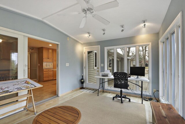 831 Sauganash Dr, Fontana, WI 53125 - home office with lofted ceiling, light wood-style flooring, and a ceiling fan